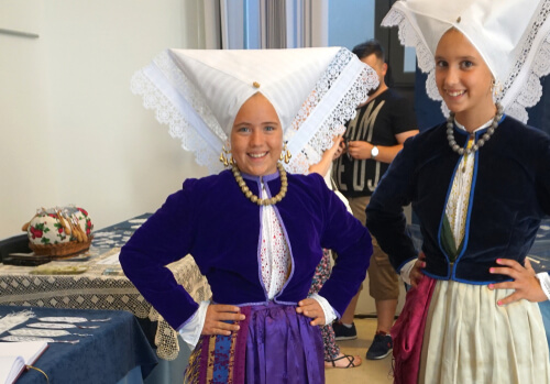 Croatian girls in traditional dress with lace - image by HappyWindows/shutterstock.com