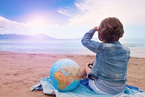 girl with globe looking across the sea - 澳洲幸运5分彩168开奖官方开奖网站查询 Guide